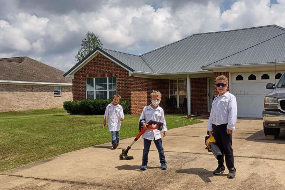 John, Daniel, and Michael after a mowing job well done.